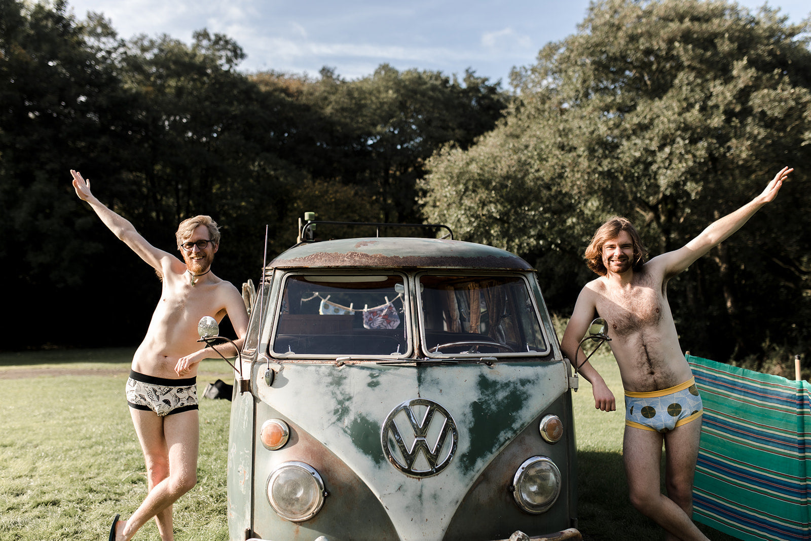 Two guys wearing Thunderpants y-front syle briefs leaning on a vw campervan